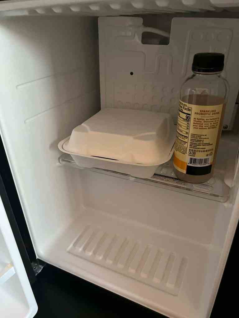 mini fridge in your room is a sustainable travel hack to reduce food waste