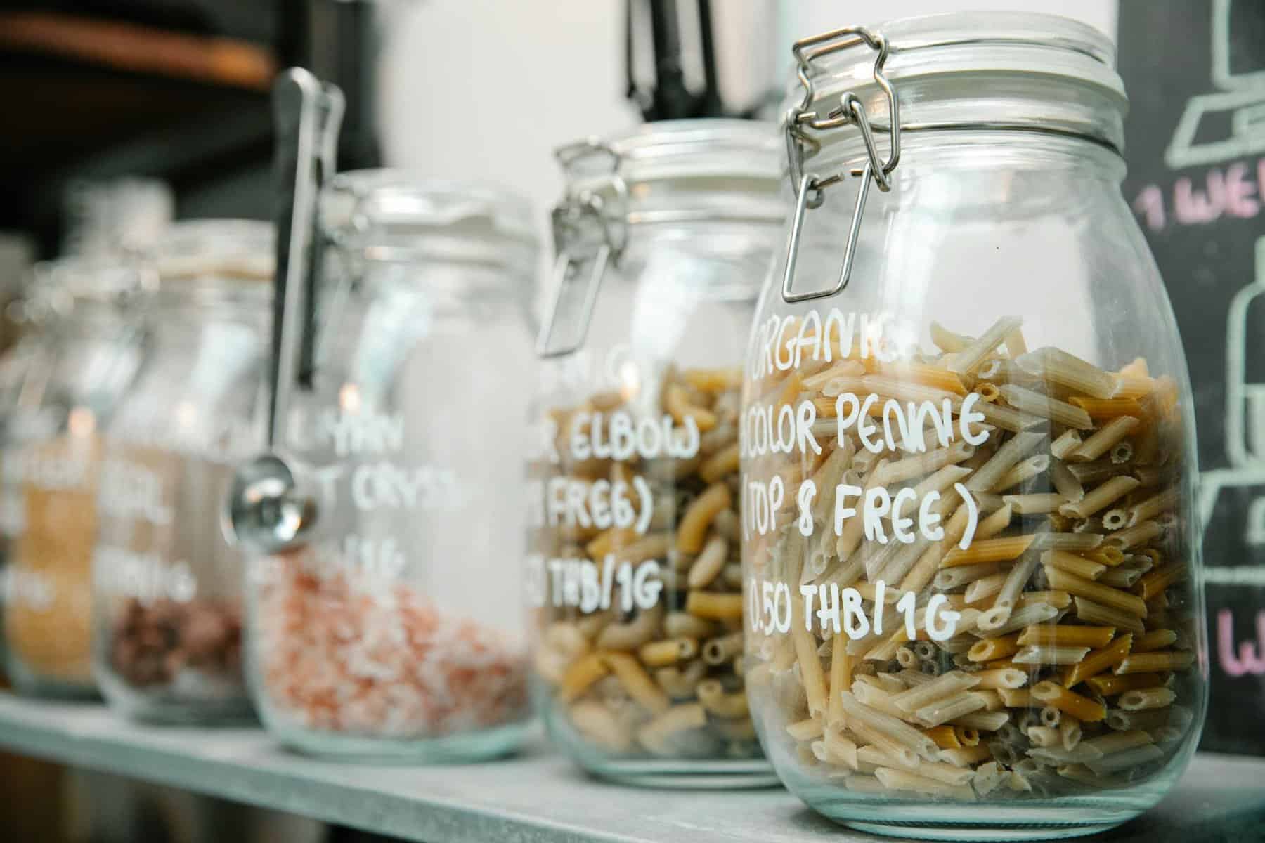 set of glass jars with pasta and various products is one of the best non toxic food storage containers