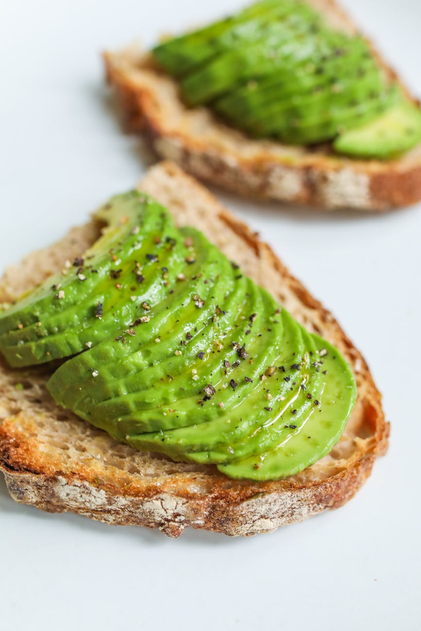 close up photo of sliced bread with avocado, a healthy part of blue zones diet recipes