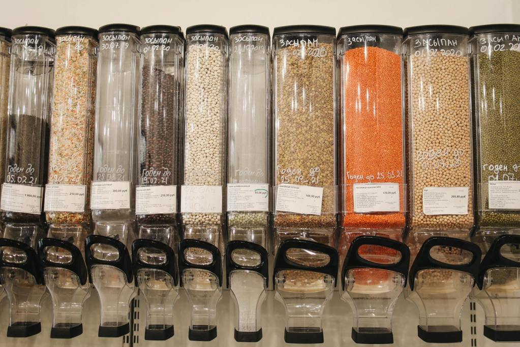 variety of spices in glass dispensers