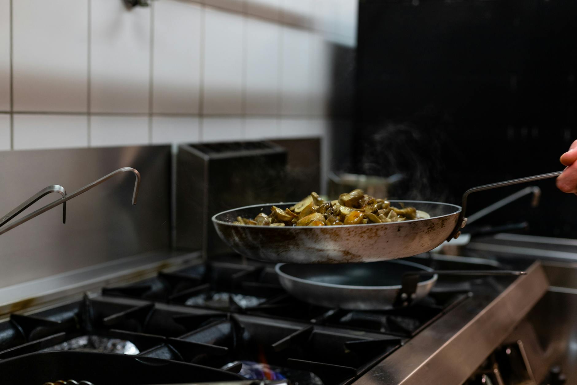 cooking of mushrooms on a carbon steel pan