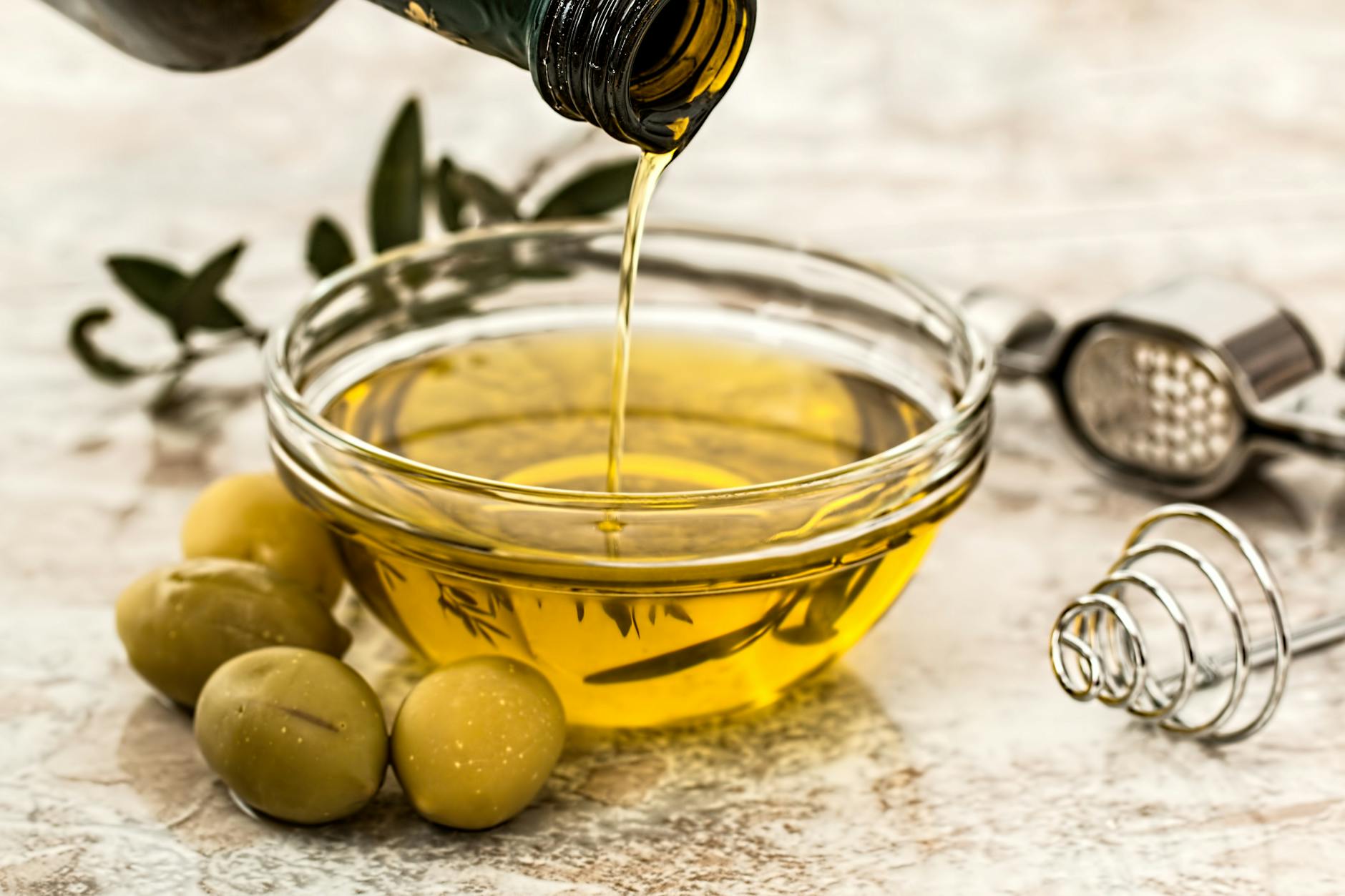 bowl being poured with olive oil the best way to store