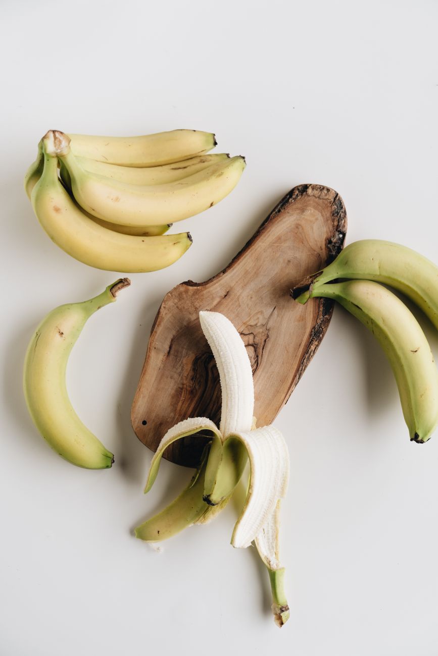 a bunch of bananas and one peeled banana - myths about organic food
